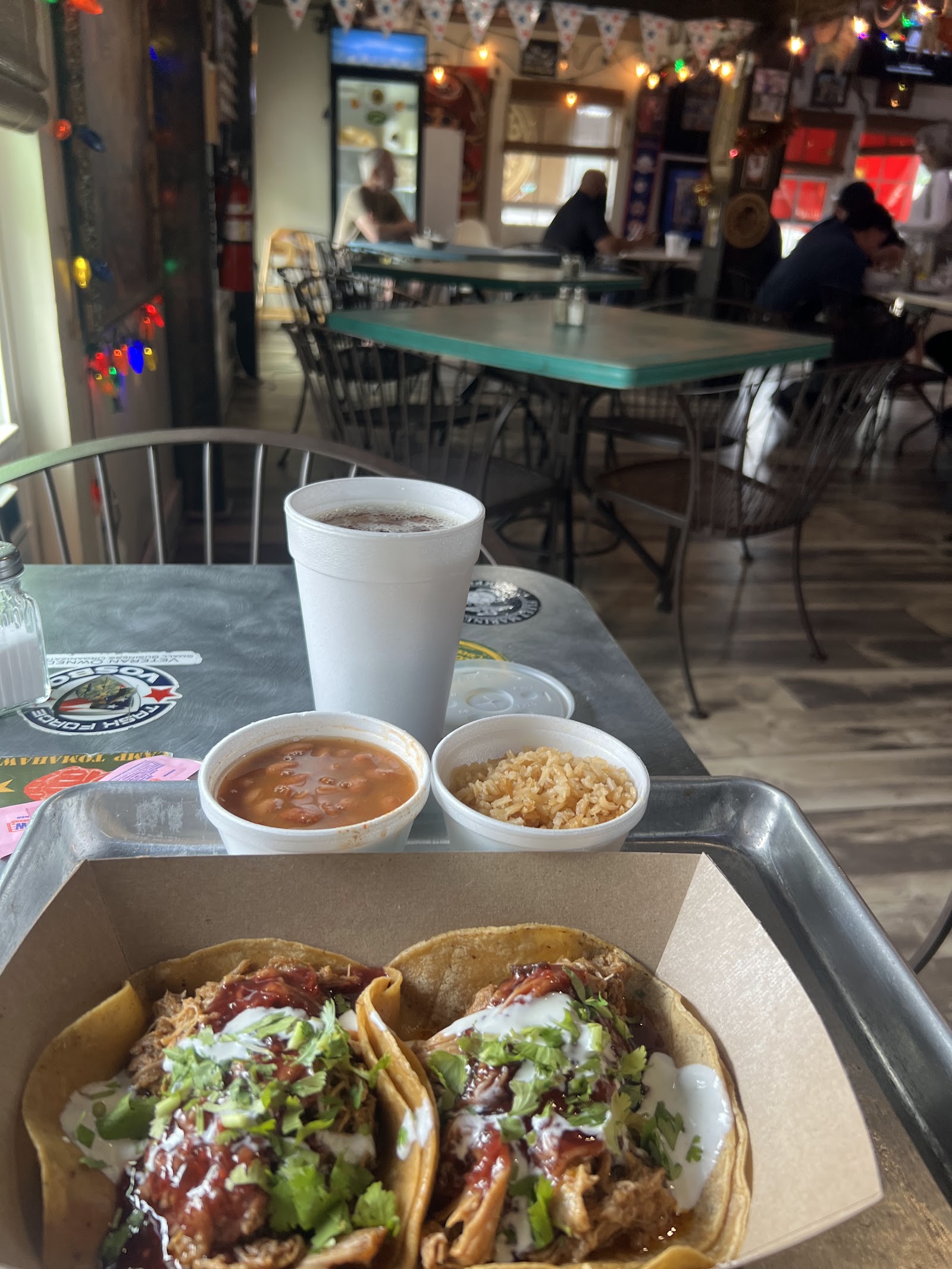 Smoked pulled pork tacos with rice and beans